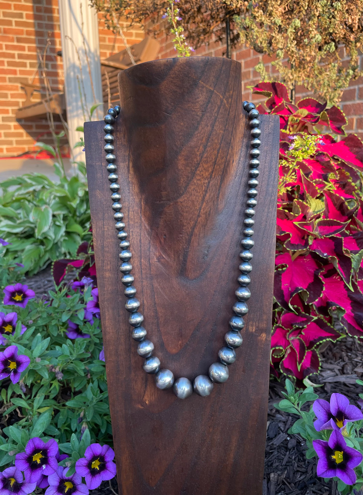 A 22 inch graduated strand of Navajo pearls